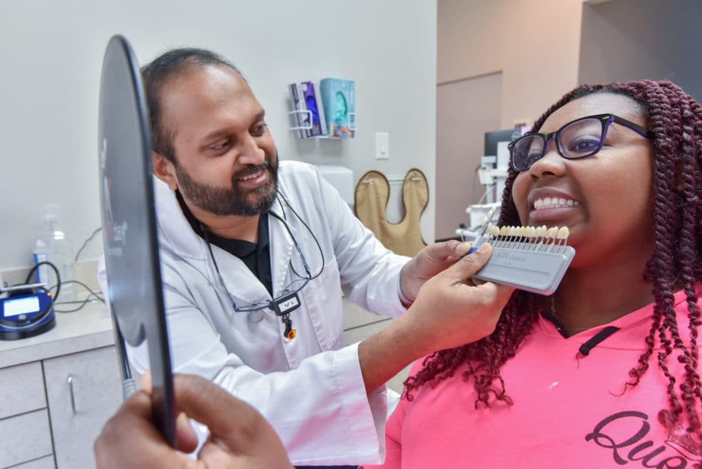 dentist in desoto performing dental treatment on a patient